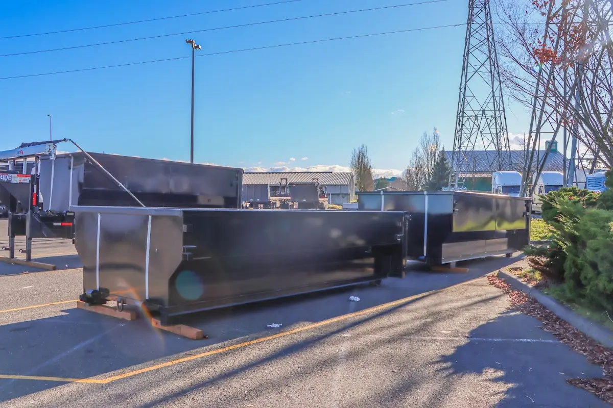Roll-off dumpster ready for waste disposal at job site for Demolition Dumpster Rental in The Woodlands